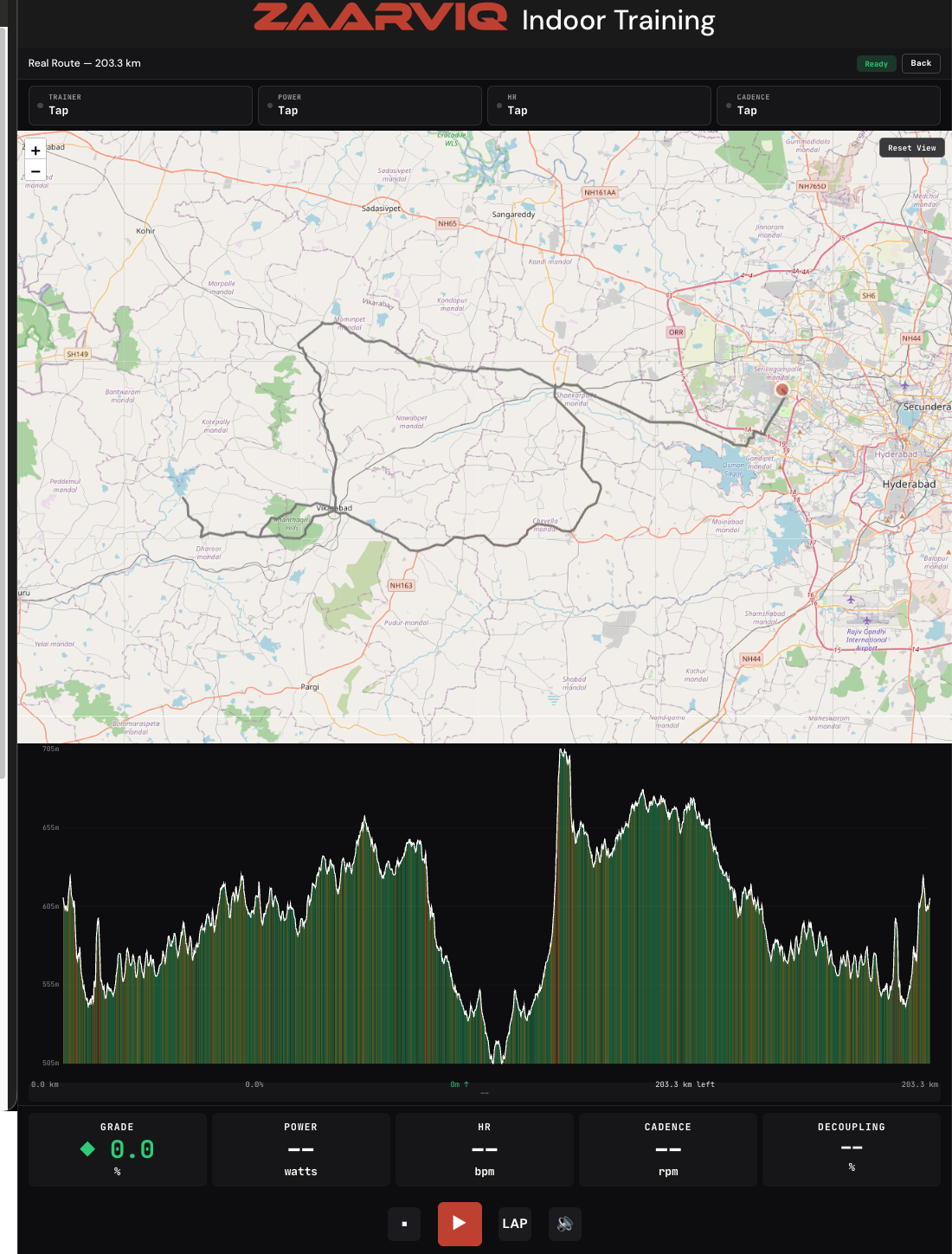 ZaarviQ indoor trainer riding a Real Route — a 203.3 km course shown live on the map with an elevation profile below and live grade, power, HR, cadence and decoupling readouts.